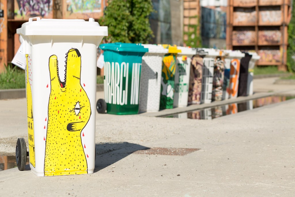 Yellow bin painted with a creature drawing